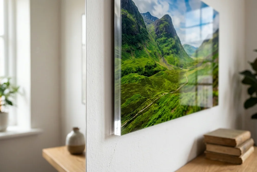 Frameless acrylic print of a green mountain valley floating off a white wall