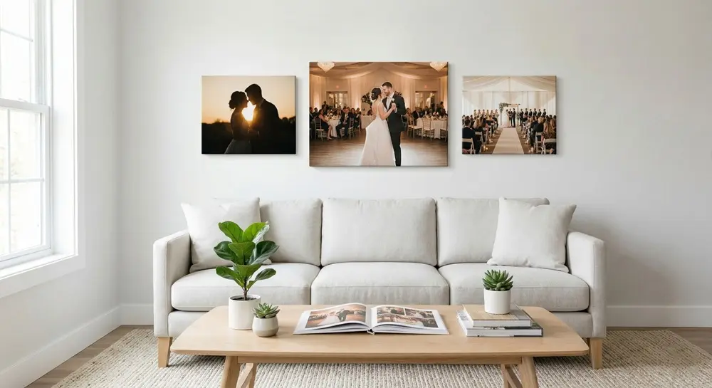 Flat lay of printed wedding photographs being arranged on a desk with colour swatches, a notebook and layout sketches for wedding album design planning