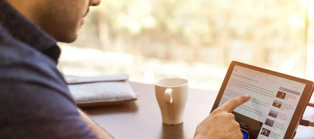 Where to Buy Canvas Online. Man browsing internet.