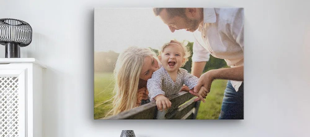 Where to Buy Canvas Online. Canvas print on wall featuring young family.
