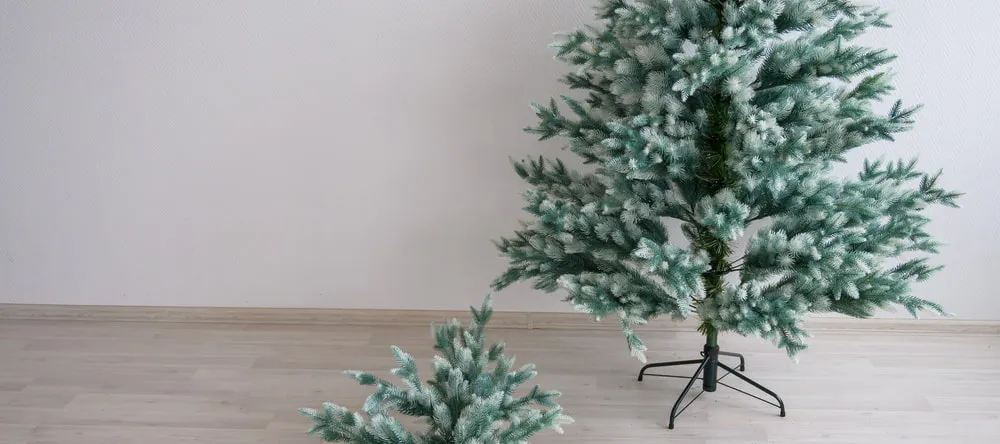 How to Decorate a Christmas Tree. Artificial Christmas trees in room.
