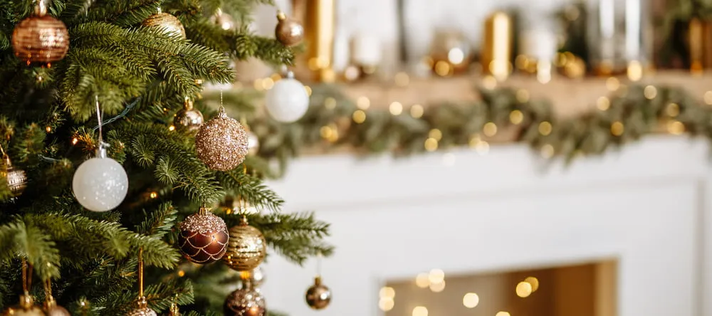 How to Decorate a Christmas Tree. Decorated Christmas tree in room.