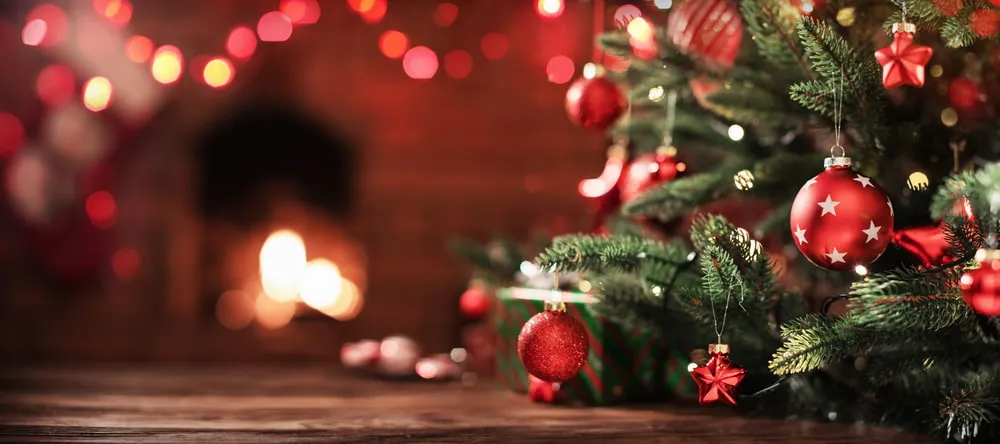 How to Decorate a Christmas Tree. Decorated Christmas tree in room.