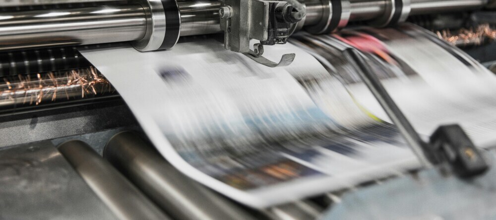 Where Can I Print a Poster? Posters coming out of printing machine.