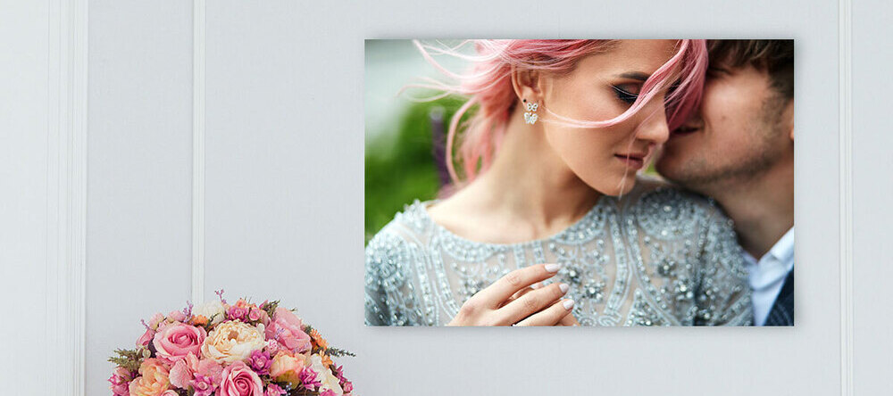 Where Can I Print a Poster? Poster with photo of couple hanging on wall.