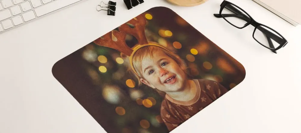 Unusual stocking fillers. Personalised photo mouse pad with photo of kid.