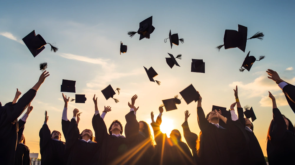 A heartfelt graduation card with a message about pride and achievement, alongside a mortarboard and diploma