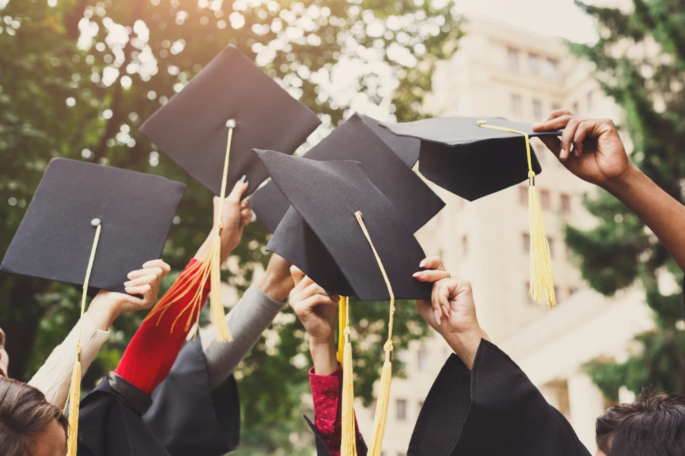 A close-up of a graduation cap and diploma, with text overlay of a powerful graduation quote like 'Achievement unlocked successfully' for custom prints