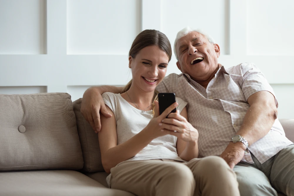 Smiling father and daughter taking a selfie, suitable for short Instagram captions and cards