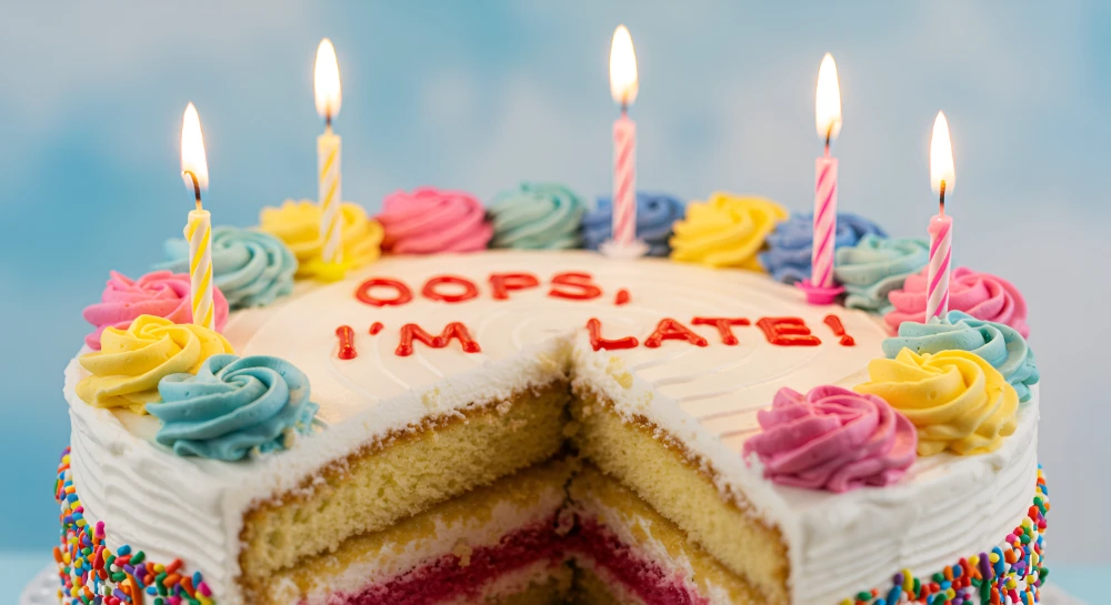 Laptop with birthday reminder, symbolizing professional belated birthday wishes