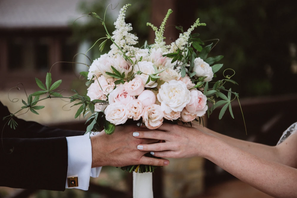 A wedding couple exchanging rings, symbolizing enduring wedding card messages and love