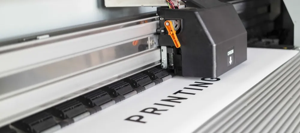 How Much Does a Canvas Print Cost? Industrial printer for canvas photo printing. 