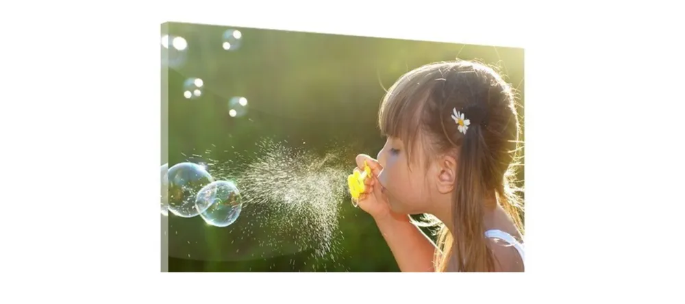 How to Hang Acrylic Prints.Photo acrylic print featuring girl blowing soap bubbles.