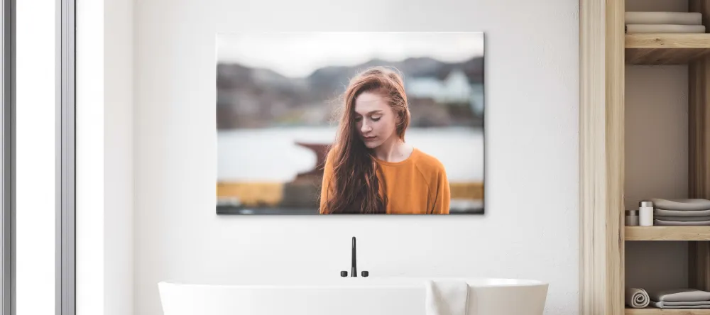 Can You Hang Canvas Prints in a Bathroom? Photo print of woman displayed in bathroom.