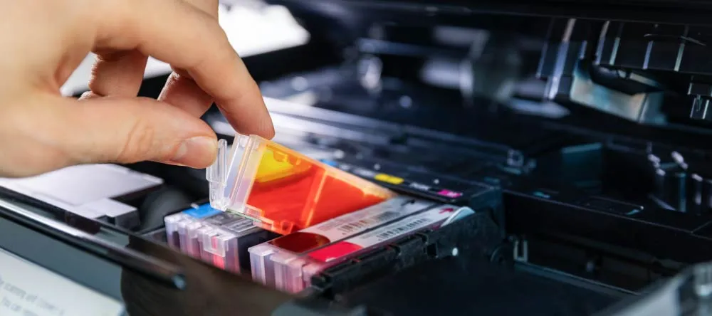 What is a Canvas Print? Inks being inserted in printer. 