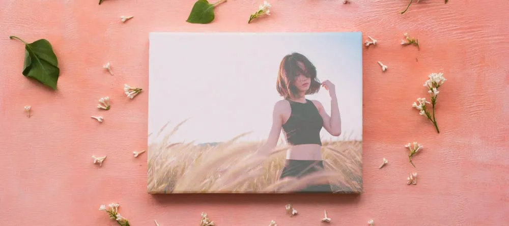 What is a Canvas Print? Small-format canvas print with photo of young lady. 