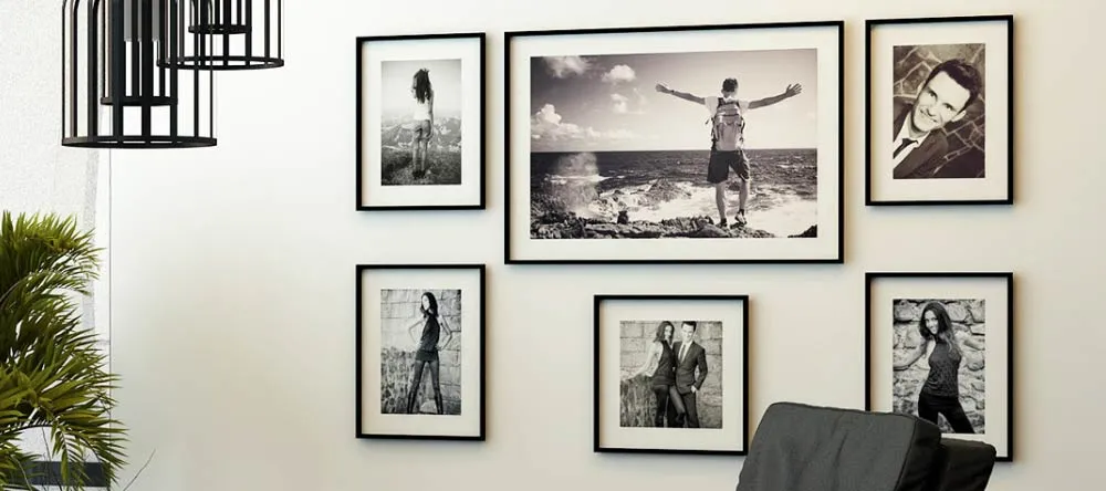 Where to Get Framed Wall Pictures for Living Room: High-Quality Prints in Minutes. Gallery wall featuring framed prints of monochromatic photos.