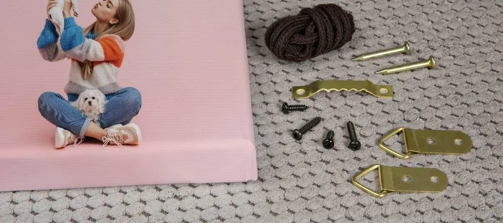 Hanging Kit for Canvas – Do You Need It? Canvas hanging kit ingredients next to canvas print. 