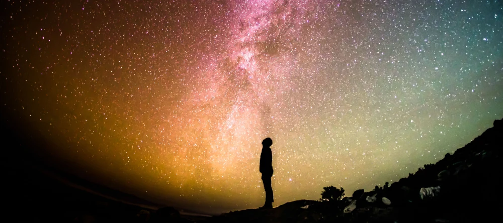Personalised Star Map: A Stunning New Gift Idea. Silhouette of a man against starry sky.