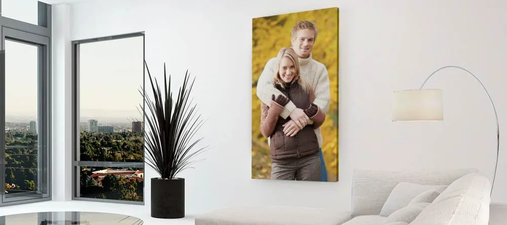 How to Print on Canvas. Photo canvas print of young couple in modern interior.