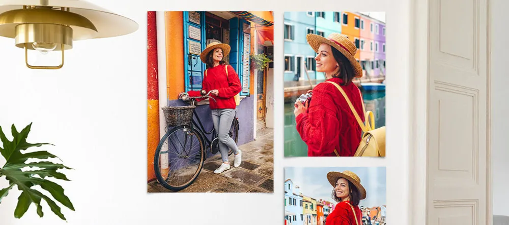 How to Hang Posters without Damaging the Wall. Photo posters on wall showing pictures of woman.