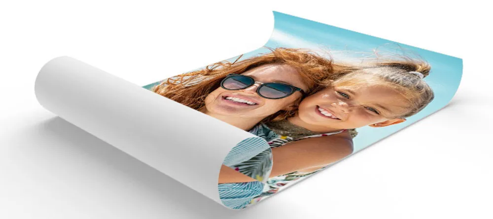 How to Hang Posters without Damaging the Wall. Photo poster lying curled up.