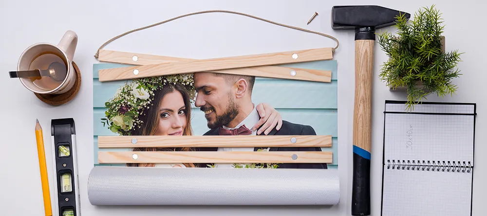 How to Hang Posters without Damaging the Wall. Photo poster with wooden hanging bars.
