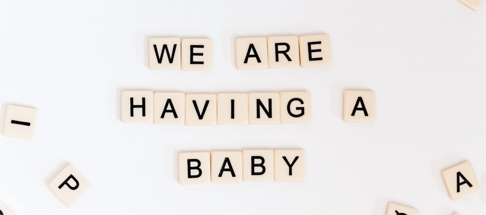 What do you take to a baby shower. Lettered tiles displaying a slogan.