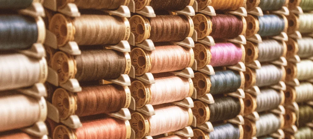 What do you take to a baby shower. Spools of thread stacked up.