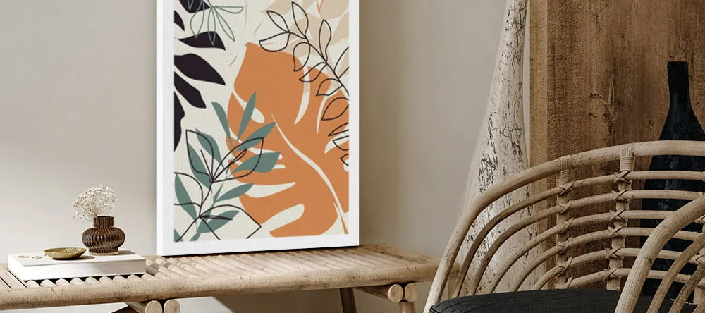What is a Rolled Canvas Print? Framed canvas print on table leaning against wall.