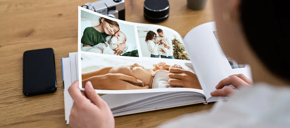 Birthday photo book: a woman flipping through a photo book