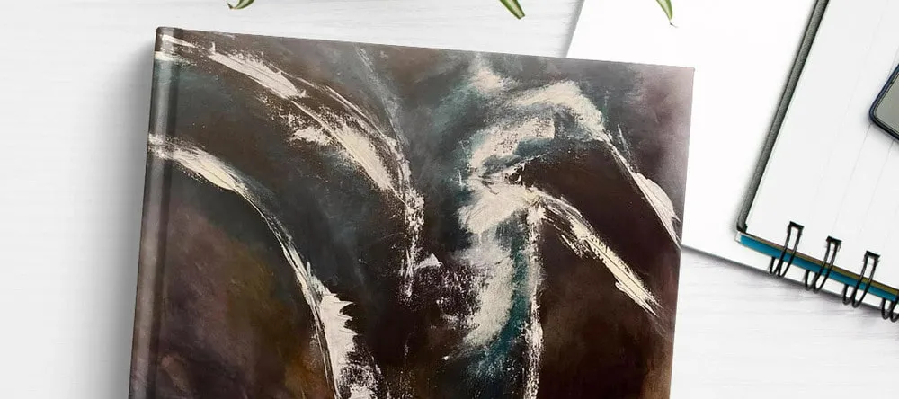 What is a Photo Book. Photo book with print of painting on cover.