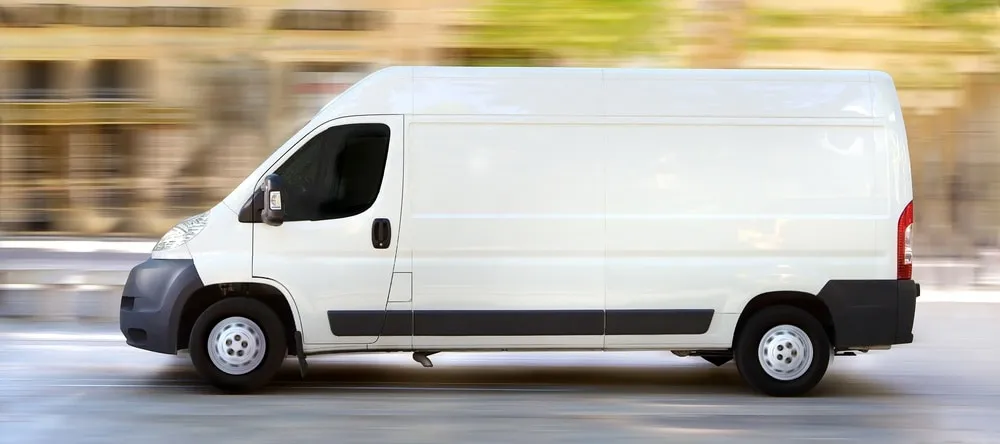 Photobook Fast Delivery UK. Delivery van travelling fast.