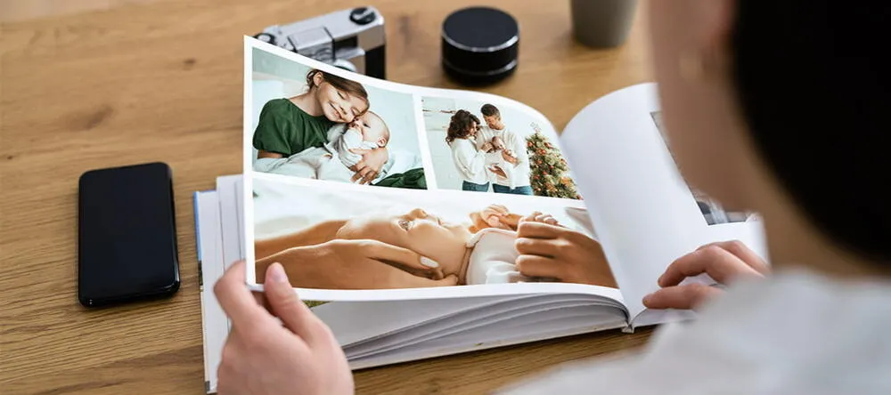 Photo Album Ideas. Woman looking through photo book.