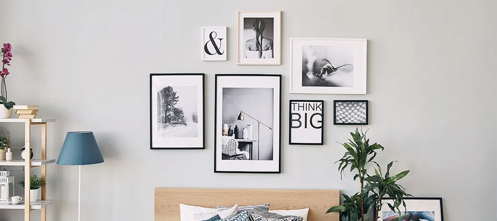 How to arrange photos on a wall: a gallery wall with mixed print formats