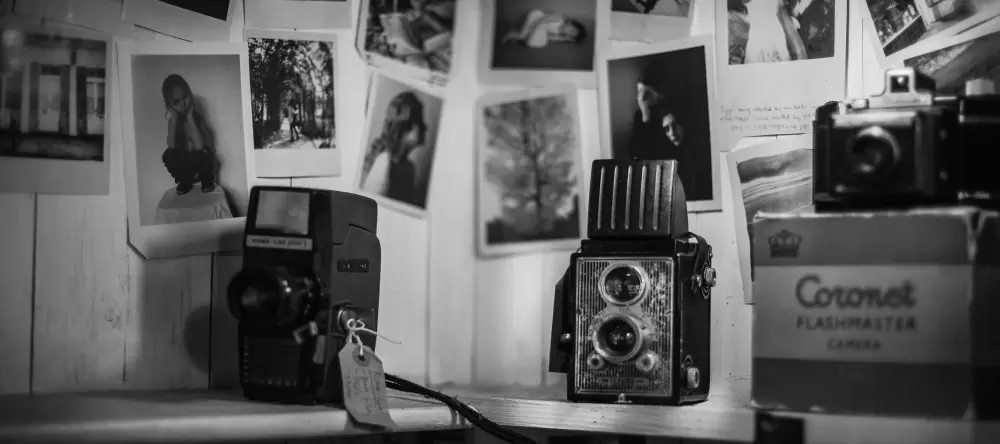 How Long Do Canvas Prints Last? Photos on wall with cameras.
