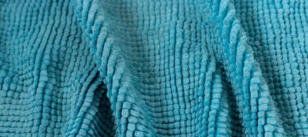 What is a Throw Blanket. Textured turquoise blanket.