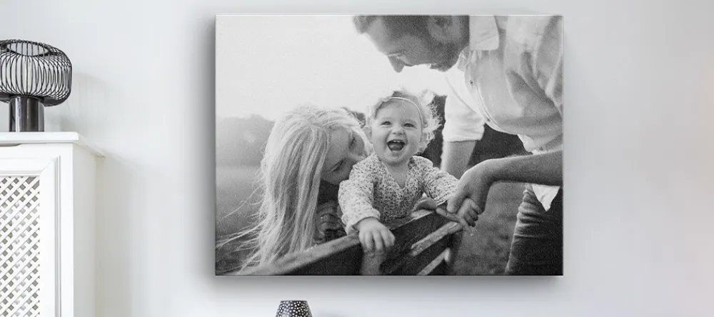 Black and White Canvas Wall Art. Monochrome canvas print featuring couple with baby.