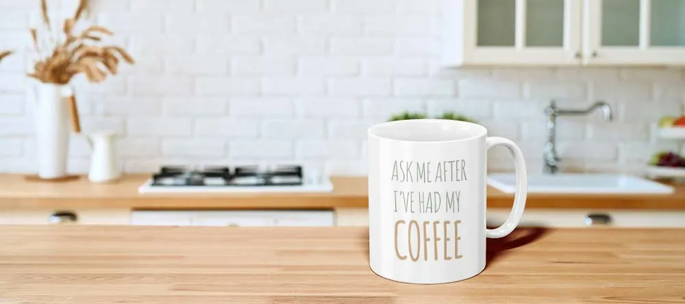 Mugs with Personalised Text. Mug with text on kitchen table.