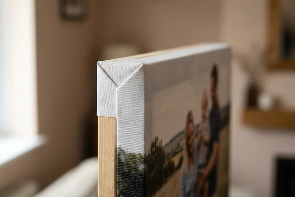 Close-up of a photo canvas corner showing the folded canvas edge and wooden frame