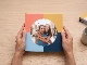softcover photo book gallery square cover held in hands thumbnail