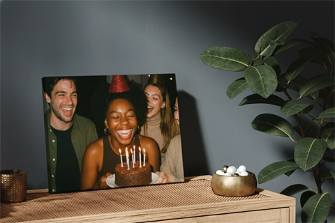 mini canvas of a birthday photo on top of a cabinet 