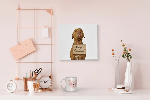 mini canvas with a dog photo on a pink wall