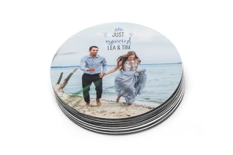 Stack of personalised round photo stickers with wedding couple design