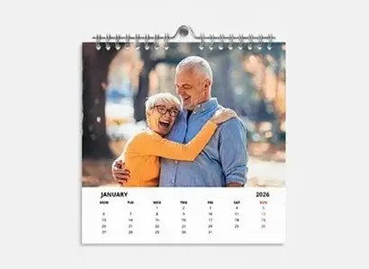 calendar showing photo of man and woman kissing baby